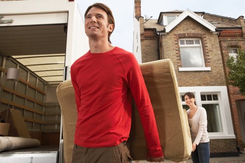 Packed household furniture stored safely in Sthelier facility